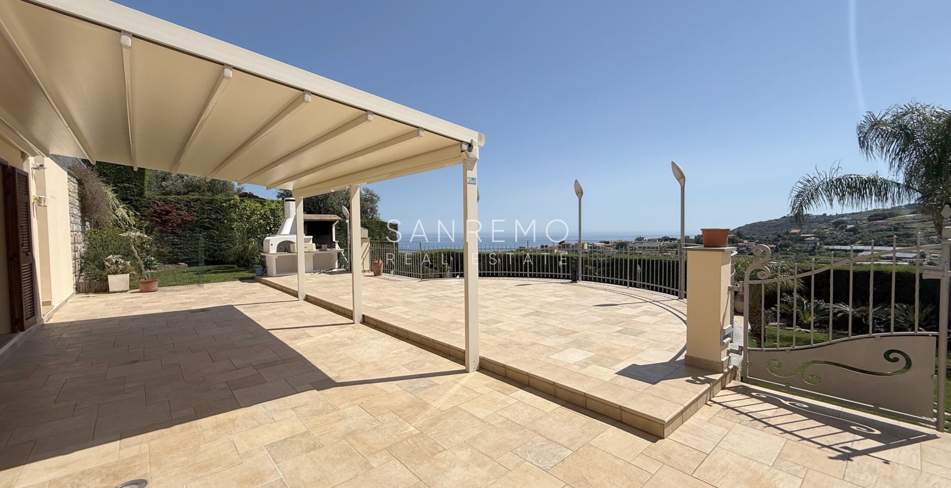 Beautiful villa surrounded by greenery with swimming pool and sea view