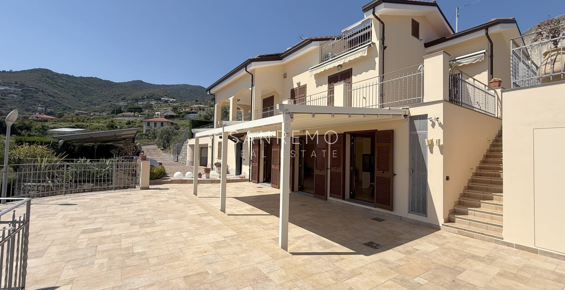 Beautiful villa surrounded by greenery with swimming pool and sea view