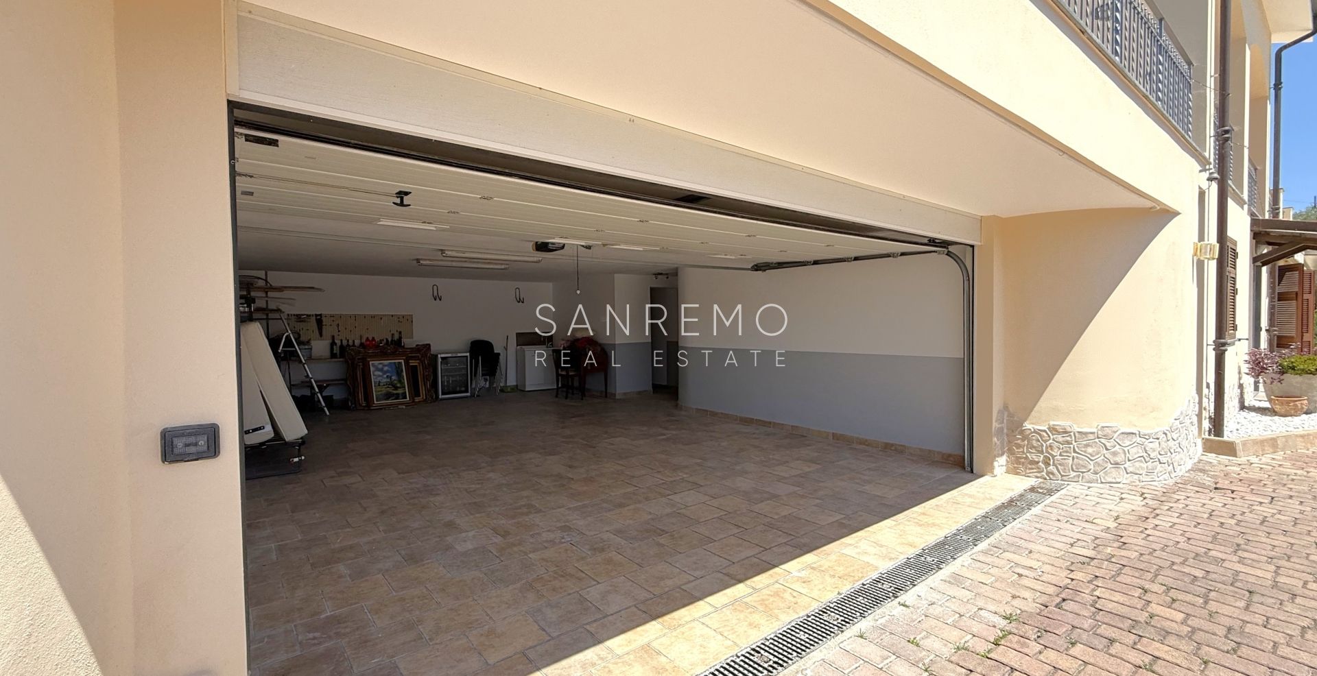 Beautiful villa surrounded by greenery with swimming pool and sea view
