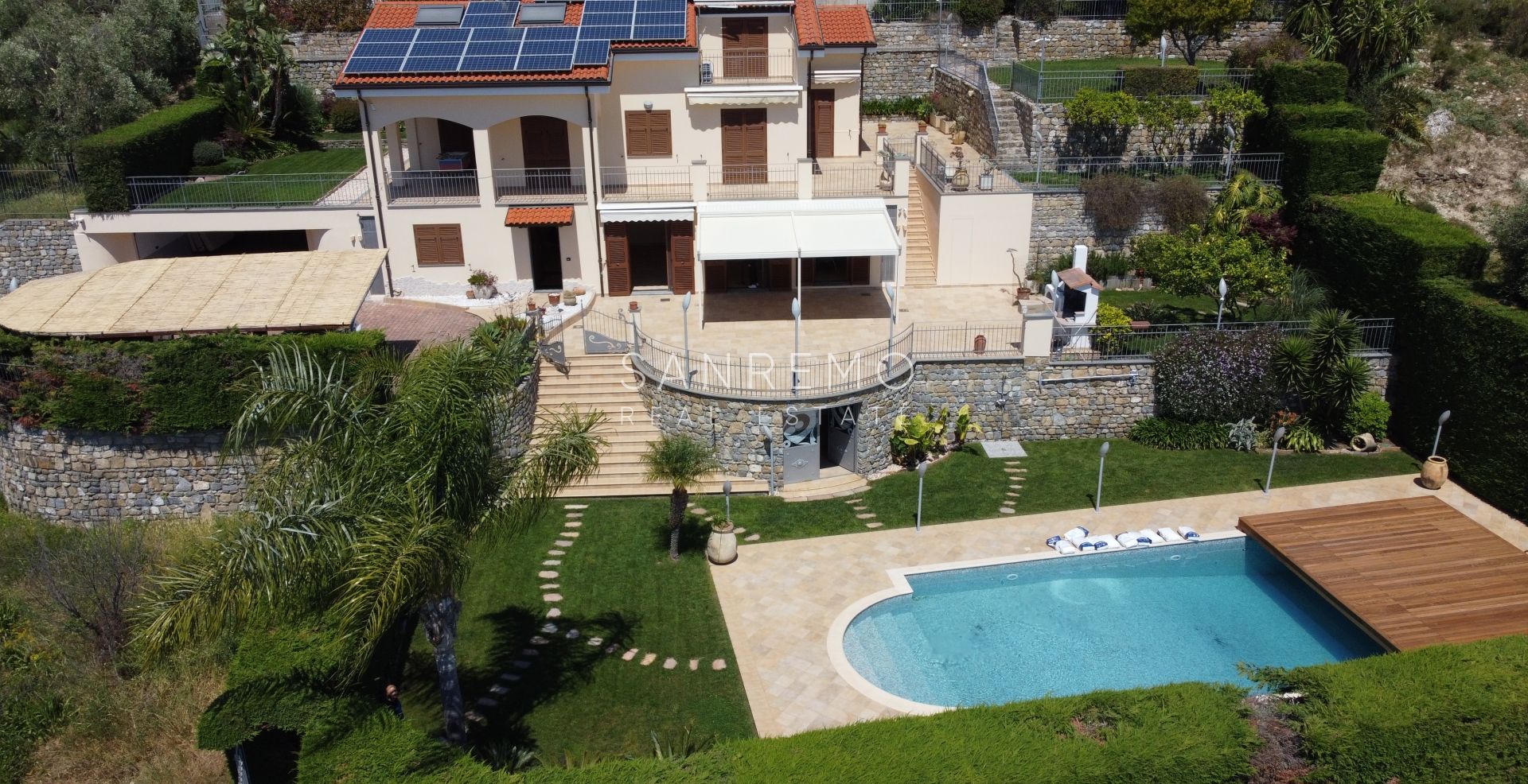 Beautiful villa surrounded by greenery with swimming pool and sea view