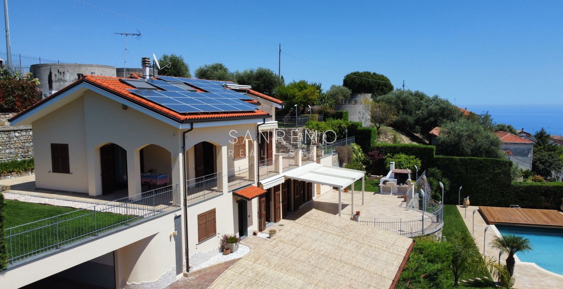 Beautiful villa surrounded by greenery with swimming pool and sea view