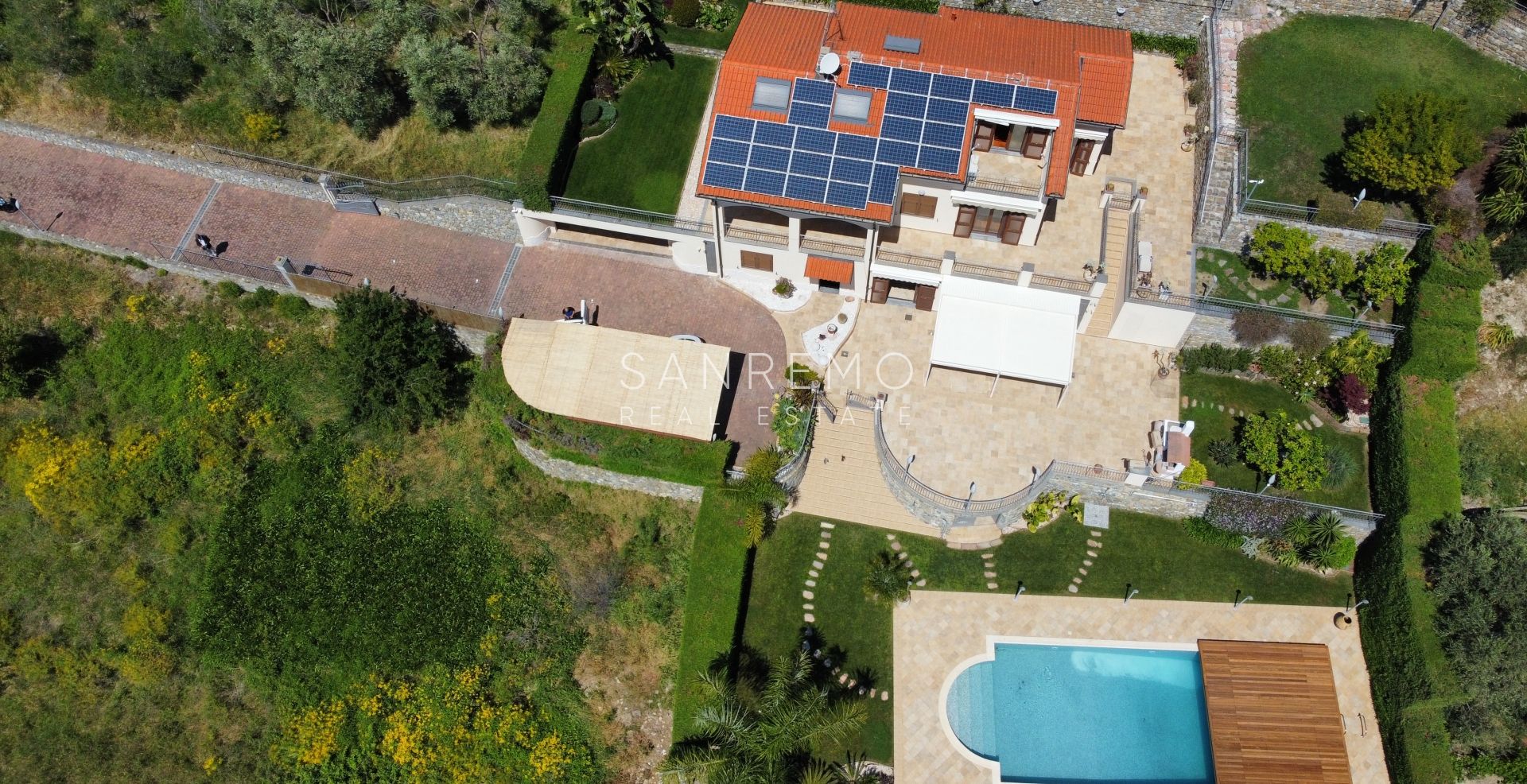 Beautiful villa surrounded by greenery with swimming pool and sea view
