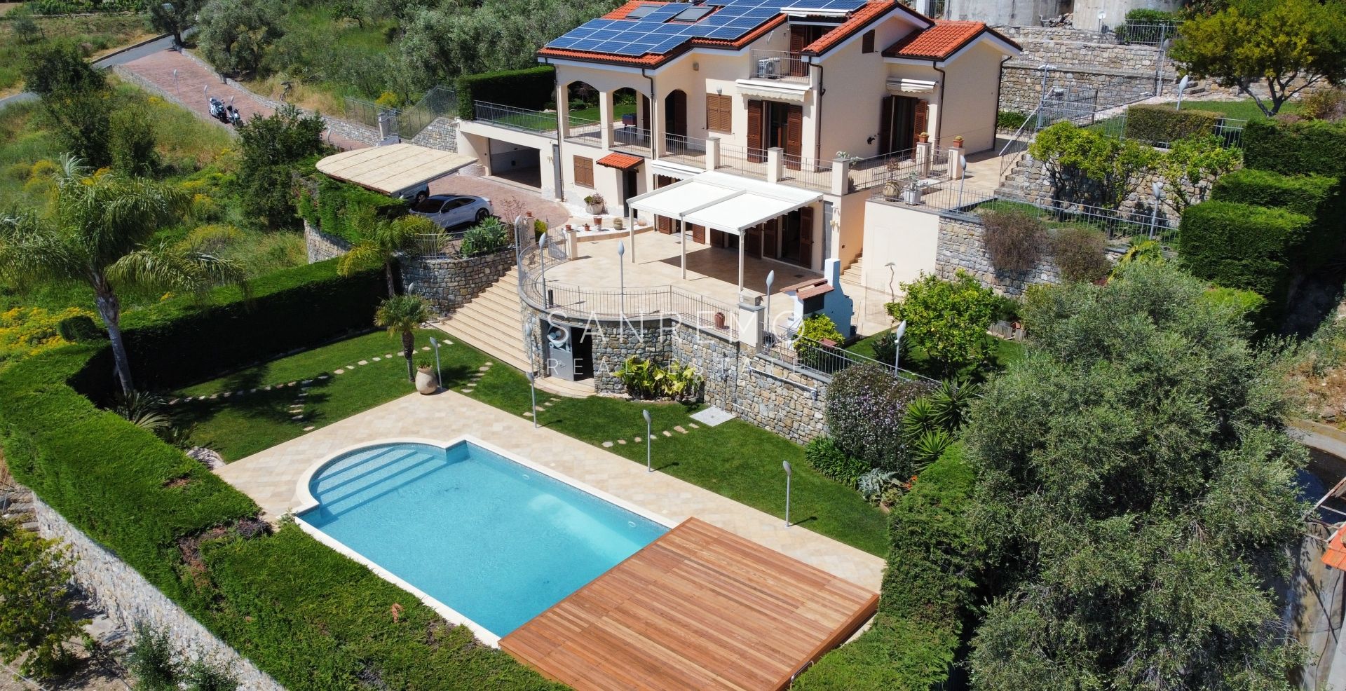 Beautiful villa surrounded by greenery with swimming pool and sea view