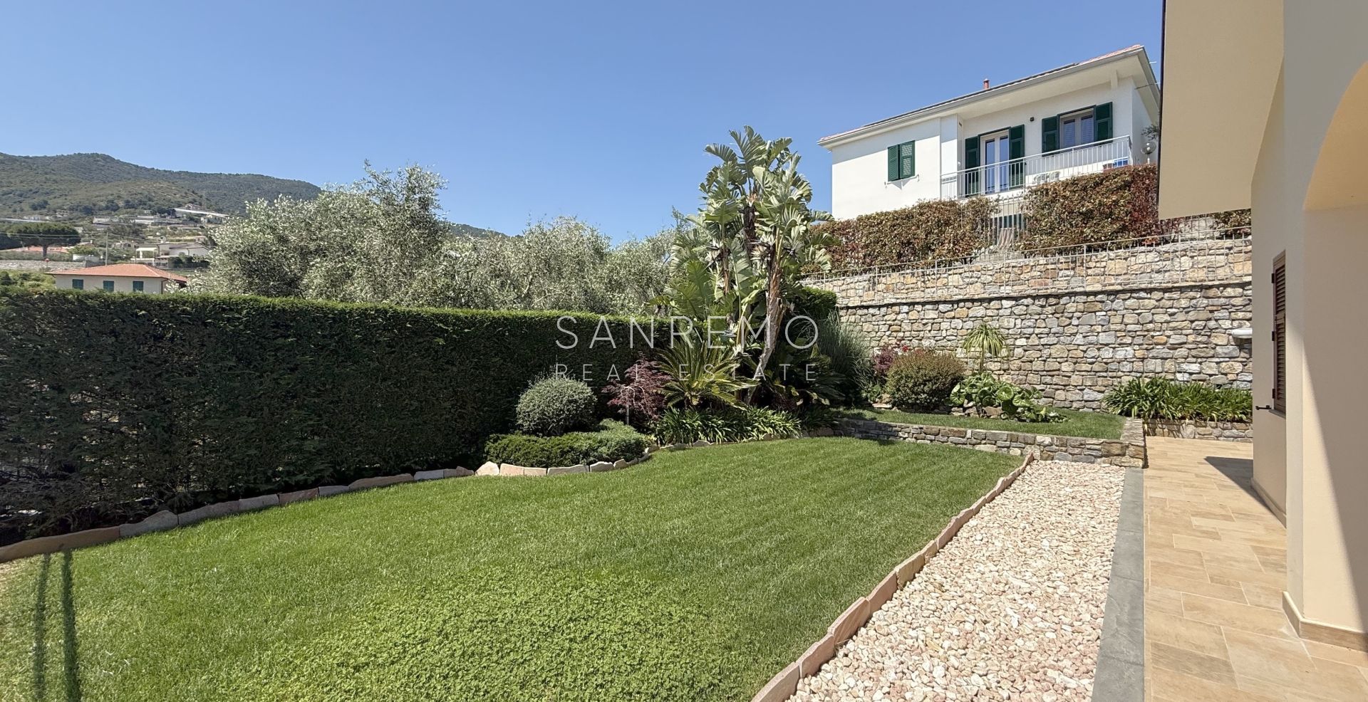 Beautiful villa surrounded by greenery with swimming pool and sea view