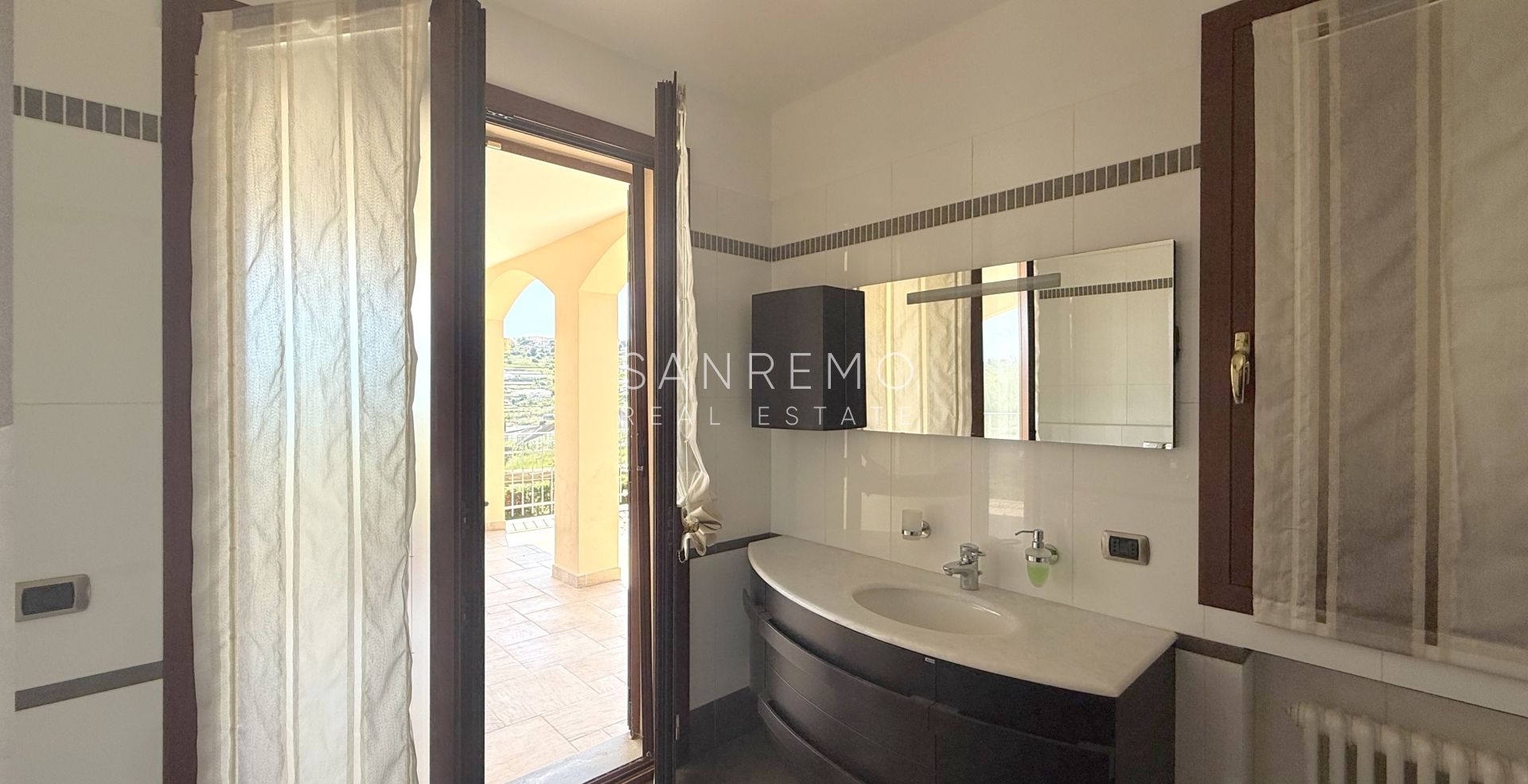 Beautiful villa surrounded by greenery with swimming pool and sea view