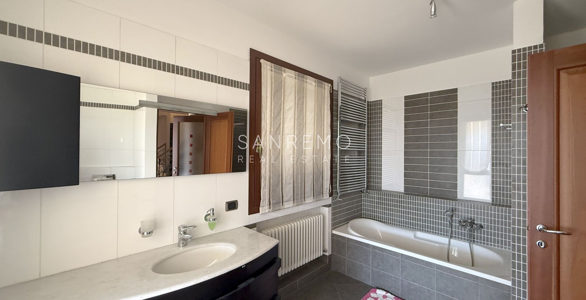 Beautiful villa surrounded by greenery with swimming pool and sea view