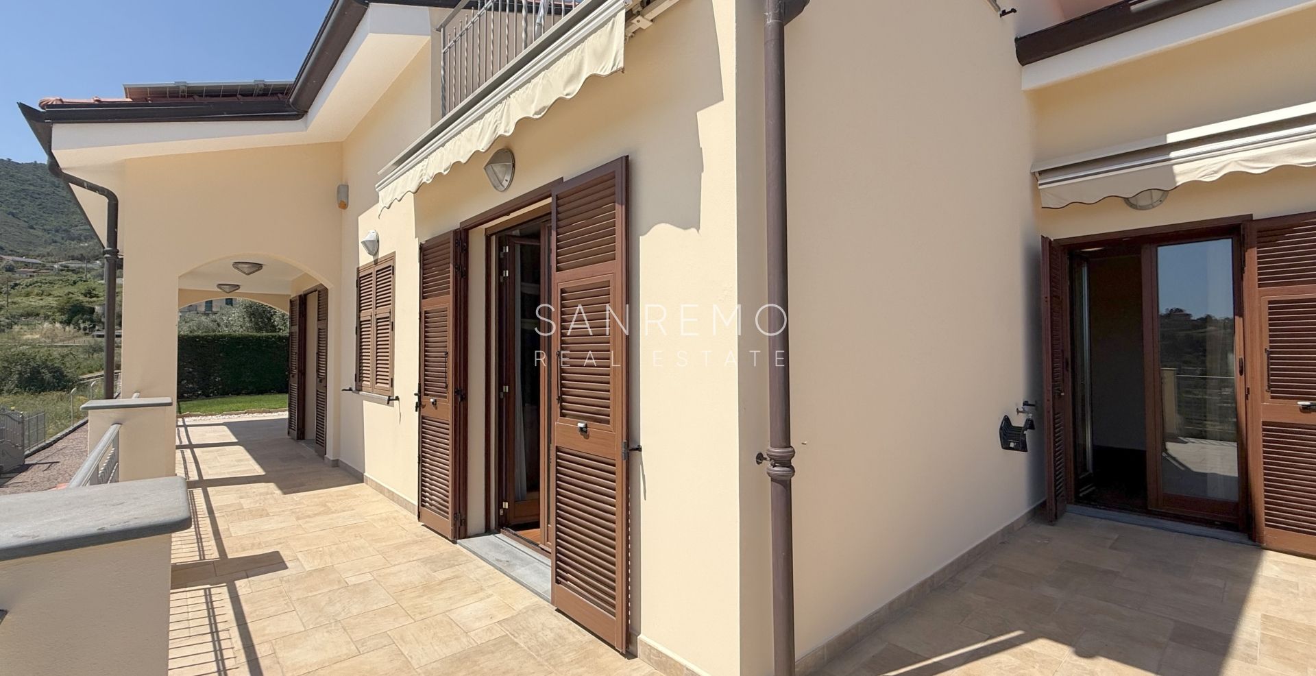 Beautiful villa surrounded by greenery with swimming pool and sea view