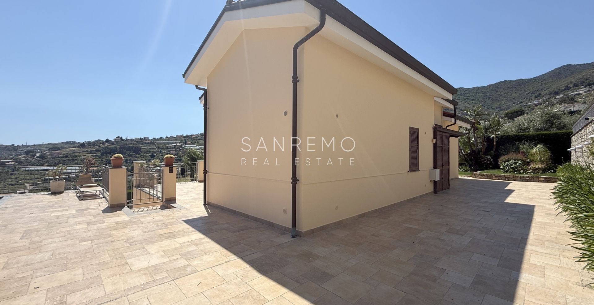 Beautiful villa surrounded by greenery with swimming pool and sea view