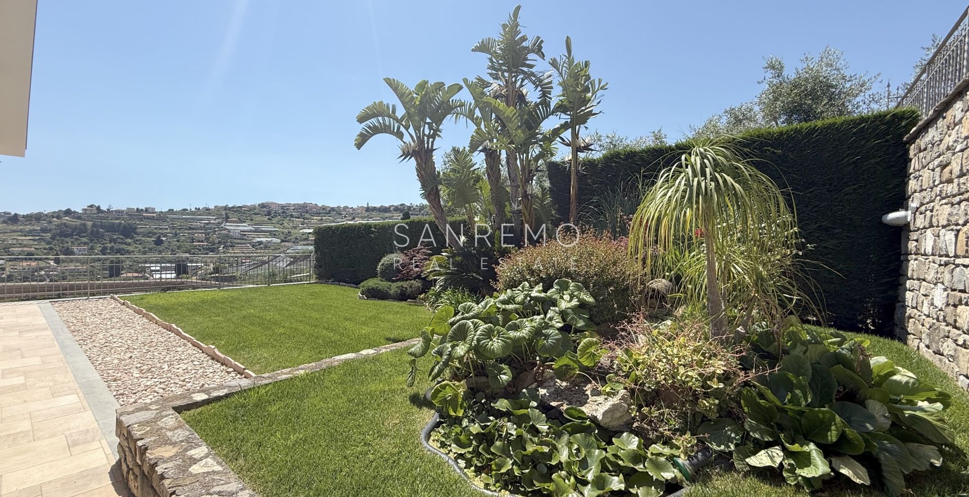 Beautiful villa surrounded by greenery with swimming pool and sea view