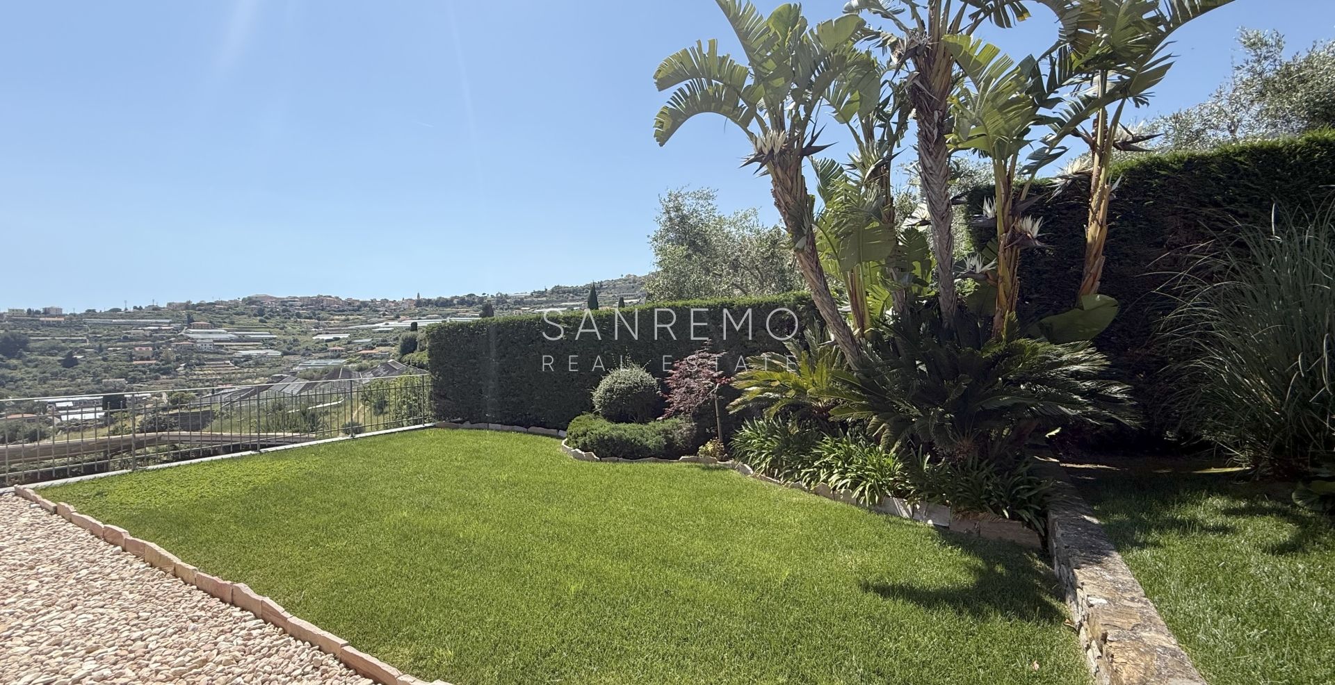 Beautiful villa surrounded by greenery with swimming pool and sea view