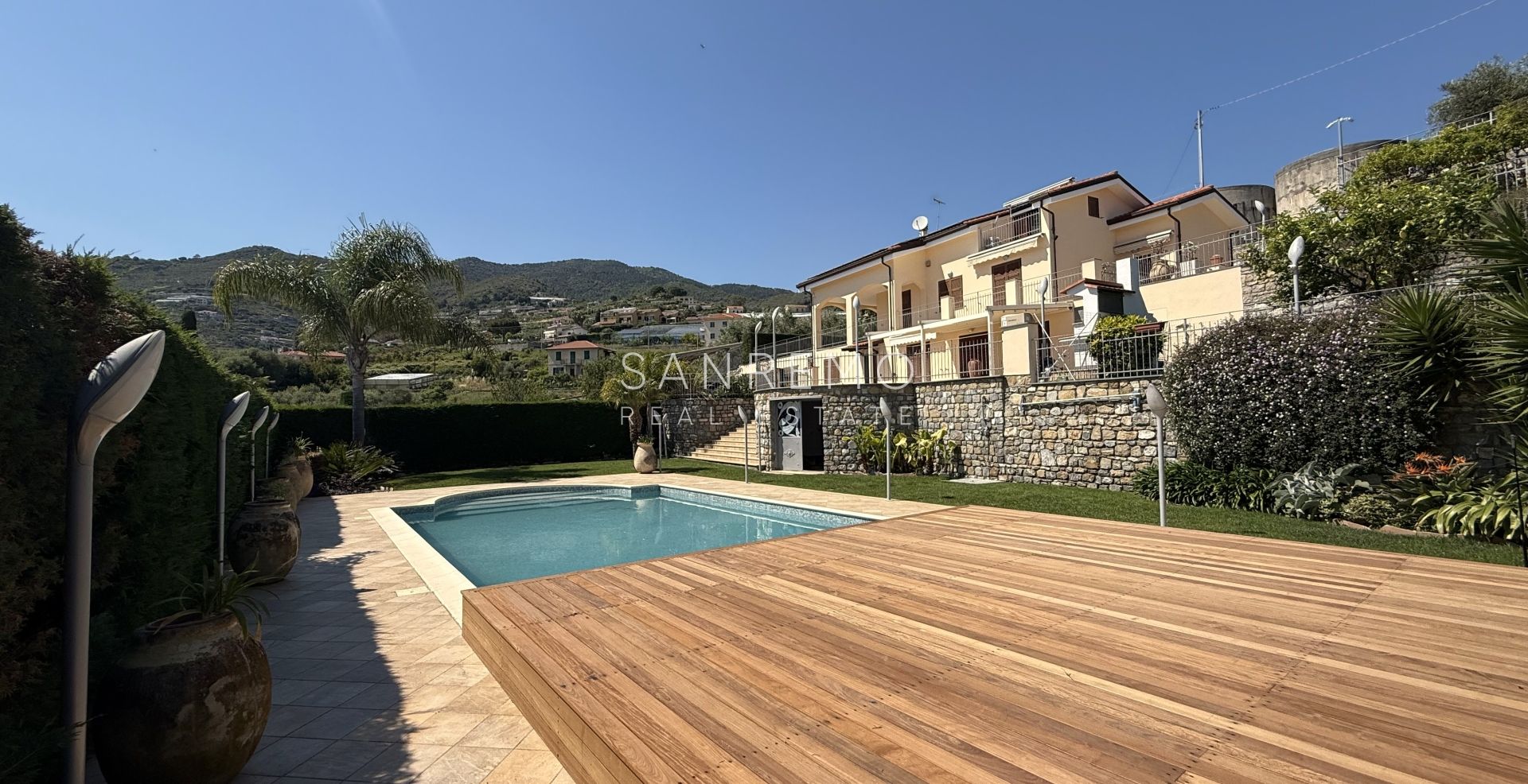 Beautiful villa surrounded by greenery with swimming pool and sea view