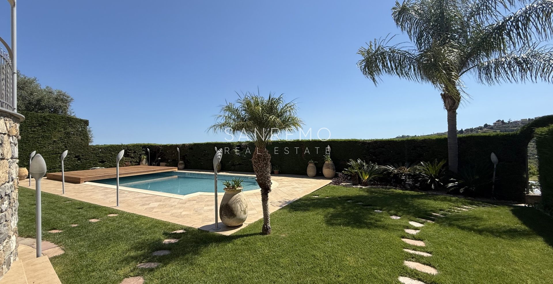 Beautiful villa surrounded by greenery with swimming pool and sea view