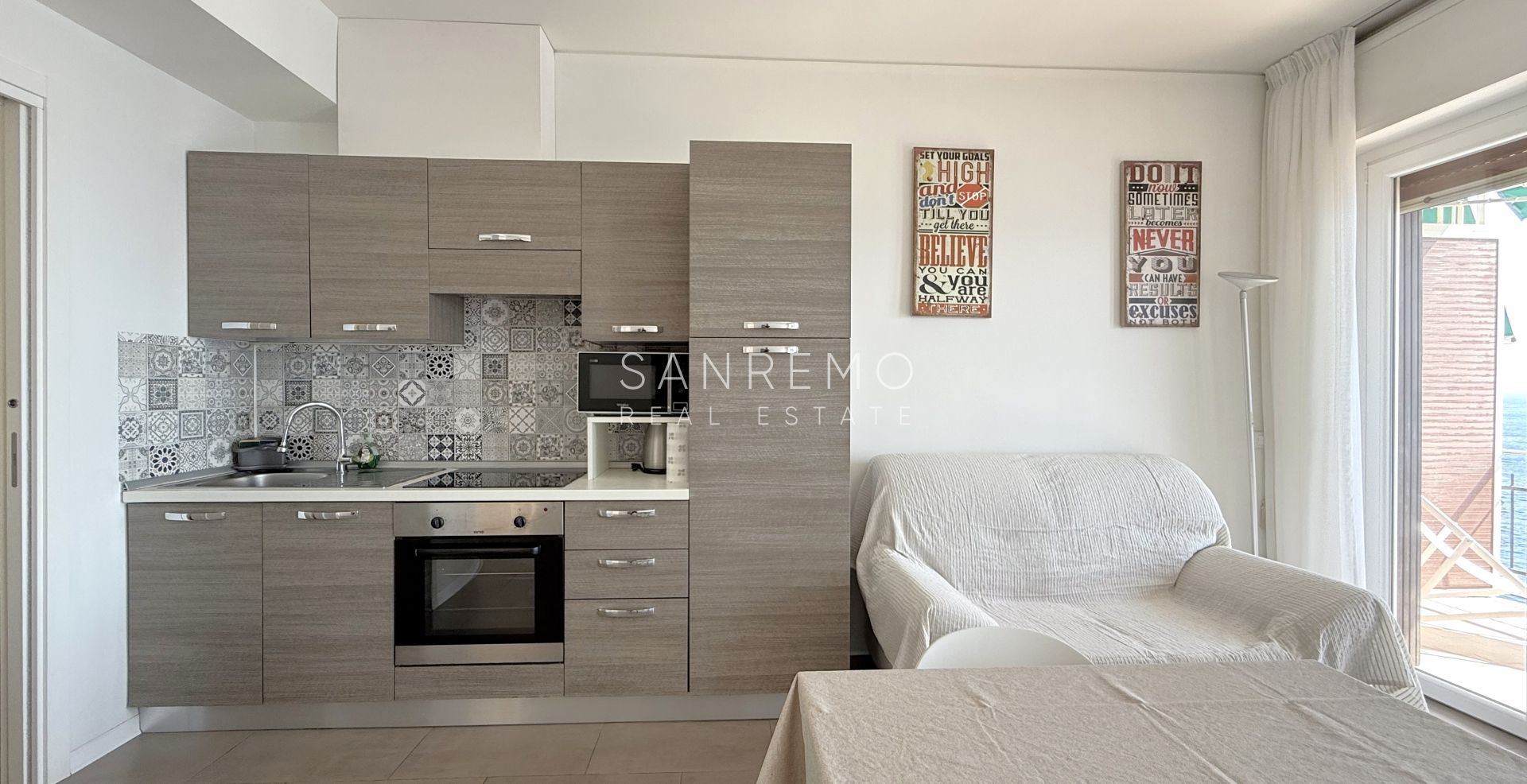 Bright one-bedroom apartment with a spacious terrace directly overlooking the sea