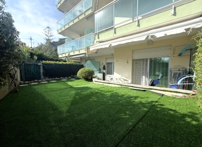Charming two-room apartment with private garden and garage